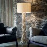 Driftwood floor lamp in metal with decorative elements in natural wood and lampshade covered in fabric