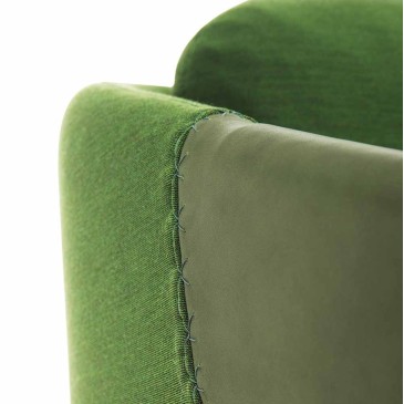 Worn upholstered armchair by Casamania structure in plywood covered in fabric with armrests in eco-leather