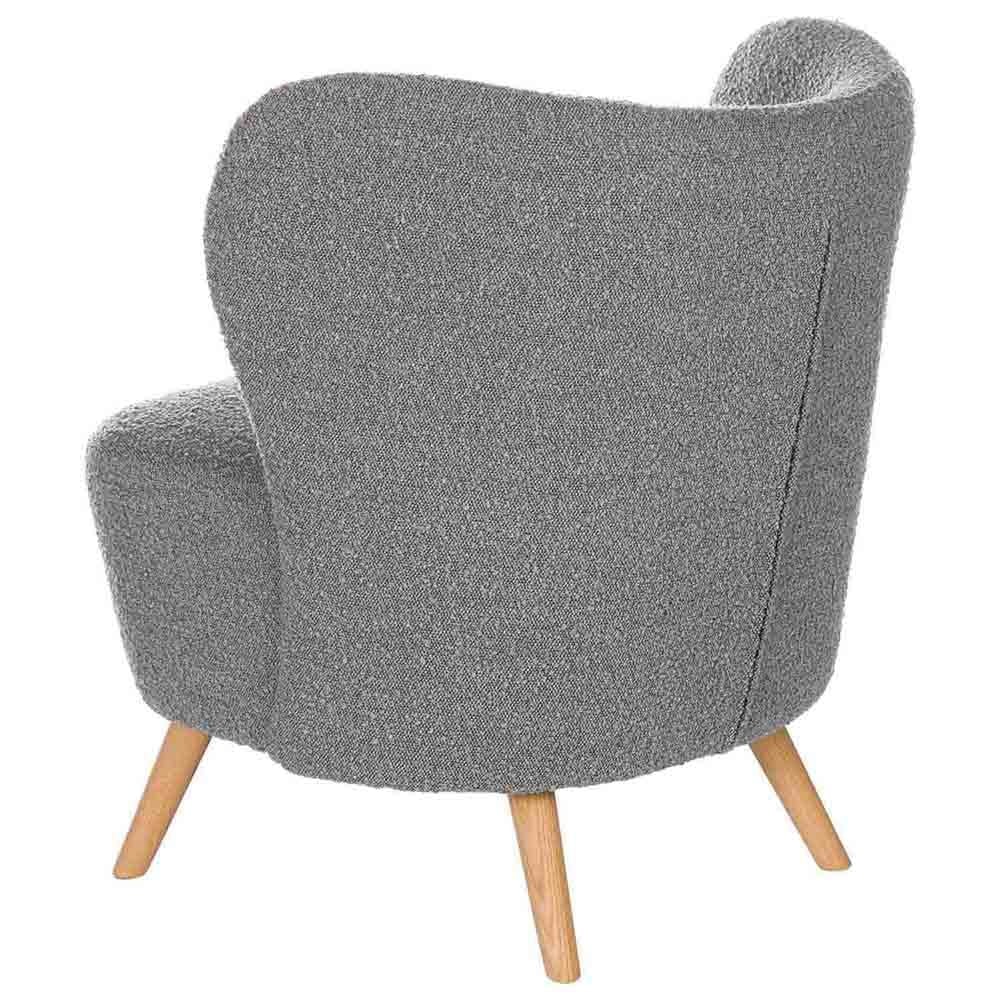Wooden armchair covered in soft shearling effect fabric