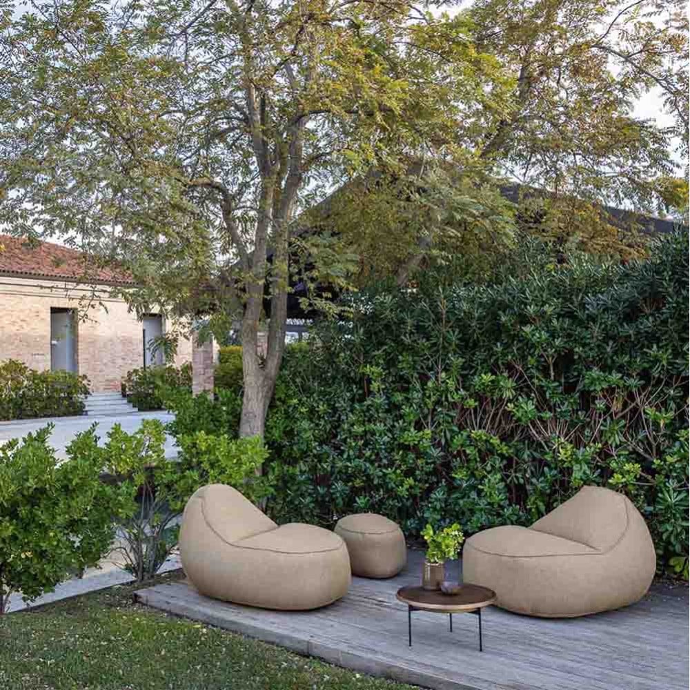 Padding and resistant fabrics characterize this outdoor pouf