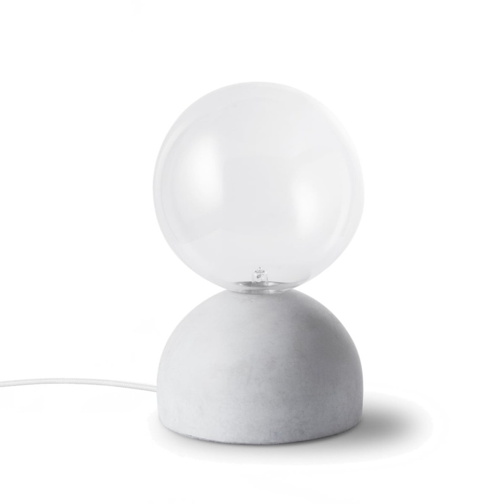 Cast table lamp with concrete base and transparent glass diffuser